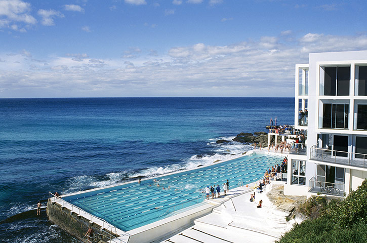 AUSTRALIA ONLINE: People swimming in a hotel pool by the sea