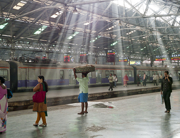 Two terminals in Mumbai: People on a platform inside Chhatrapati Shivaji Terminus 