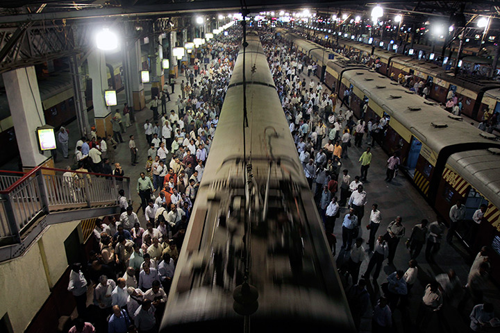 Two terminals in Mumbai: Daily commuters get ready to board local trains at Chhatrapati Shivaji Term