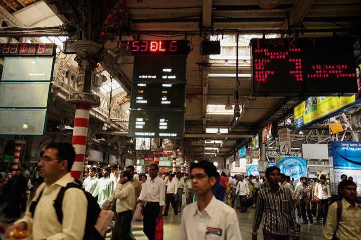 Two terminals in Mumbai: Commuters inside the terminus