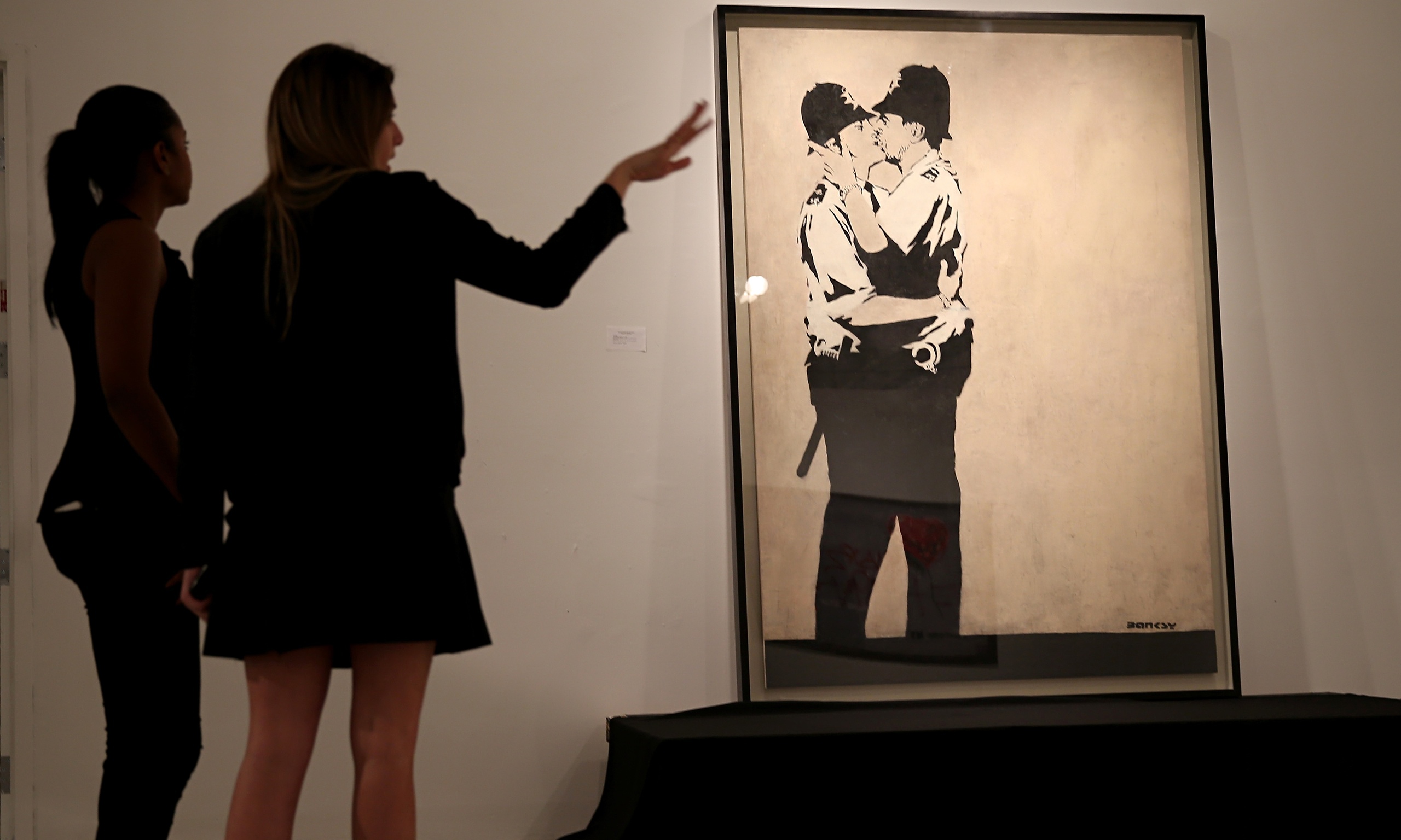 Banksy's Kissing Coppers – taken from a pub wall in Brighton – sells