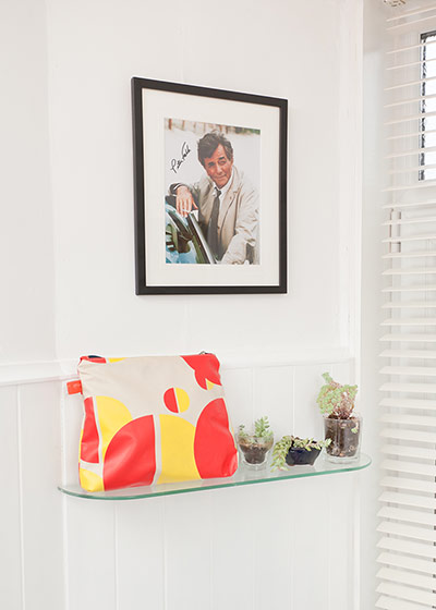 Homes - Glasgow: detail of house with picture on wall and colourful make-up bag