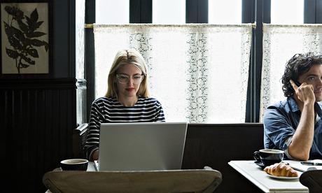 Lady using laptop in cafe