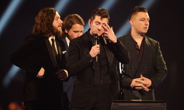 Cheer up: Alex Turner, Jamie Cook, Nick O'Malley, and Matt Helders of Arctic Monkeys accept their Best Album Award.