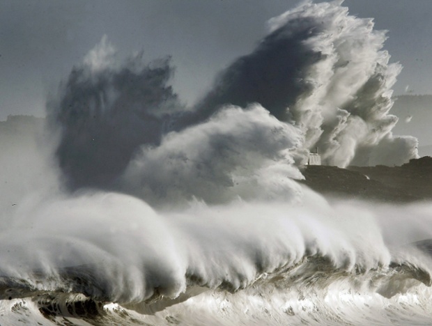 Huge waves hit Mouro island near the port of Santander, northern Spain.