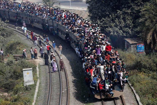 Commuters ride on the roof of a train as they return to Dhaka, Bangladesh, after the Akheri Munajat, the second largest Muslim congregation after the Haj.