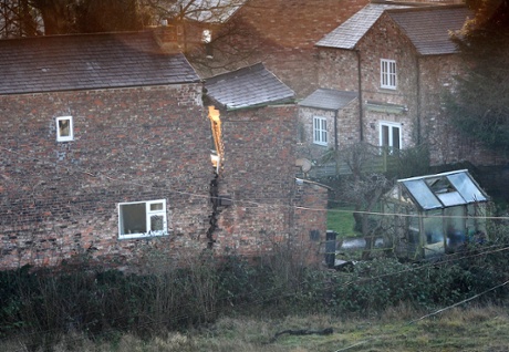 A view of a large crack on a house in Magadalen's Close, Ripon after a huge 25ft wide sinkhole opened up in the street.