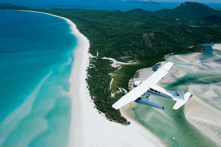 Australia costal: Australia: Whitehaven beach from the air with plane in shot