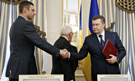Vitali Klitschko and Viktor Yanukovych shake hands