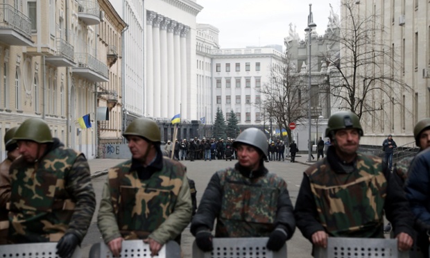 Anti-government protesters guard the  the Ukrainian Parliament building in Kiev.