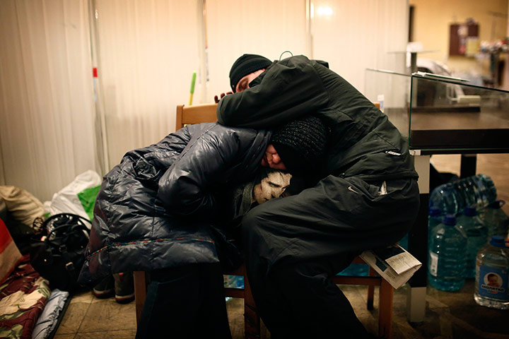 Kiev protests: Demonstrators rest in the early morning