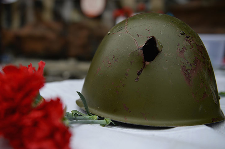 Kiev protests: The helmet of an anti-government demonstrator killed in clashes