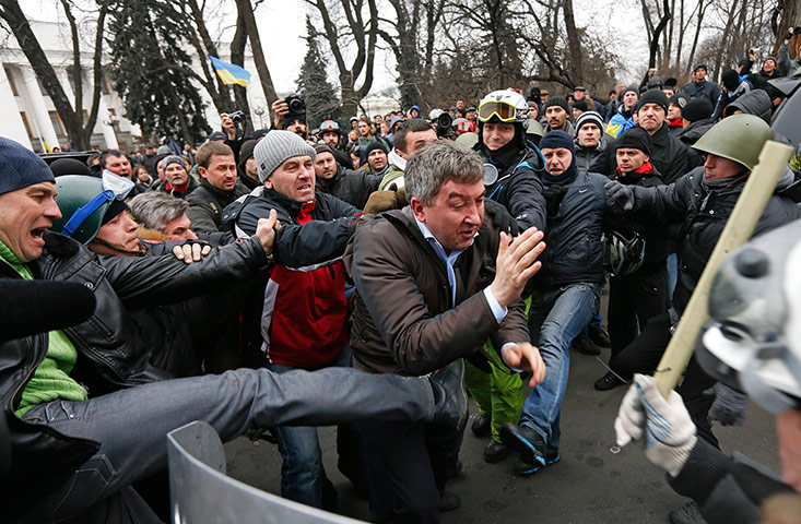 Kiev protests: Anti-government protesters attack a deputy 