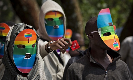 Kenyans wear masks to preserve their anonymity while staging a rare protest last month against Ugand
