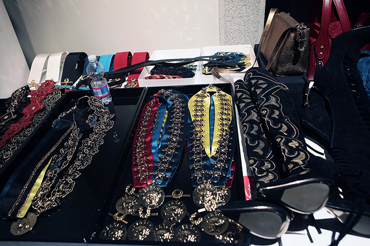 Versace: A table adorned with military buttons and frogging