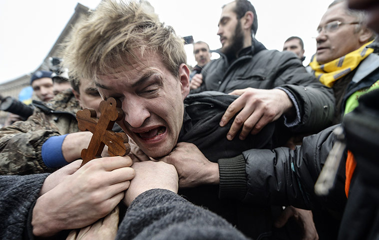 kiev protests: An alleged sniper is beaten