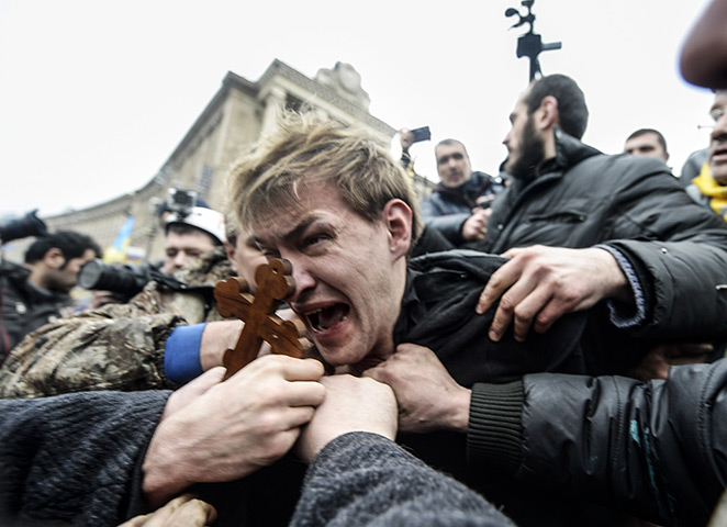 weekend in pictures: An alleged pro-government sniper in Kiev
