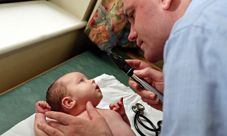 Doctor giving 8 week old baby polio vaccine