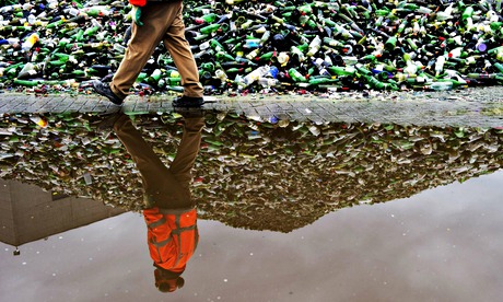 TOPSHOTS-A worker at a glass recycling f