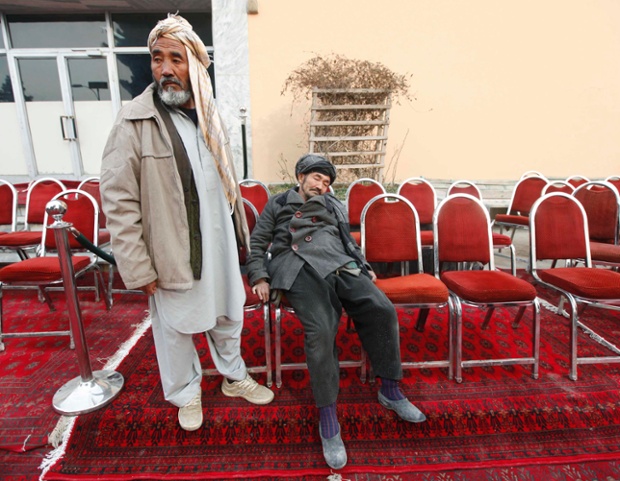 Ghulam Hussain, right, mourns after his son was killed in a Taliban attack, during a tribute ceremony in Kabul, Afghanistan