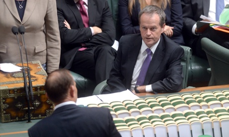 Opposition leader Bill Shorten listens to Prime Minister Tony Abbott during the House of Representatives Question time in Canberra
