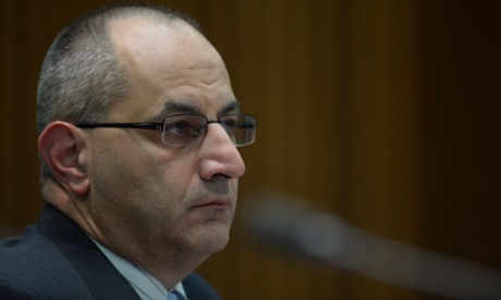 Customs chief Mike Pezzullo reacts during Senate Estimates at Parliament House in Canberra, Tuesday, Feb. 25, 2014.