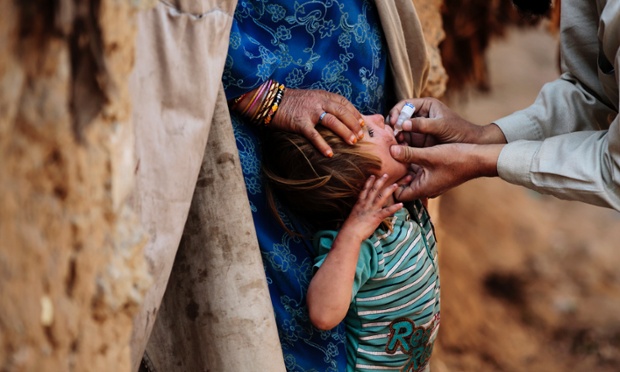 Pakistani health workers during a polio vaccination campaign in Rawalpindi, Pakistan.