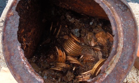 A can containing 19th-century gold coins as it was found by a California couple.