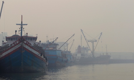 A port is covered with thick haze in Port Klang, outside Kuala Lumpur, Malaysia, Tuesday, Feb. 25, 2014.
