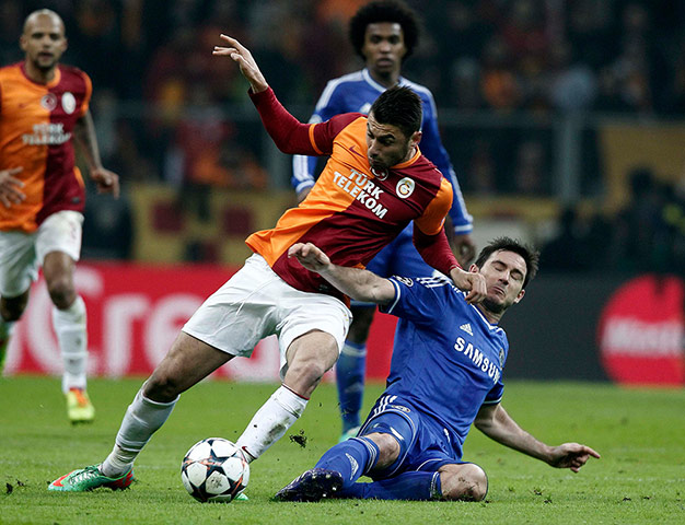 galatasary v chelsea: Chelsea's Lampard fights for the ball with Galatasaray's Yilmaz