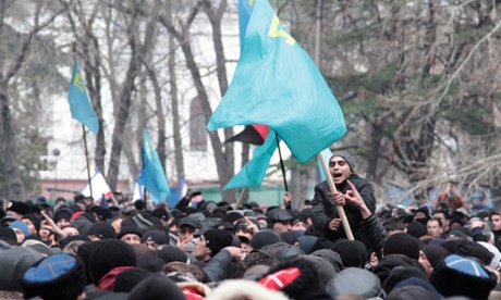 Nationalist Crimean tatars wave blue flags as they gather in Simferopol on Wednesday.