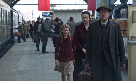 Liesel (Sophie Nélisse) meets her new foster parents, Hans (Geoffrey Rush) and Rosa (Emily Watson). 