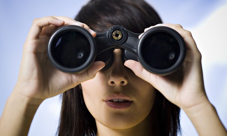Women looks through binoculars
