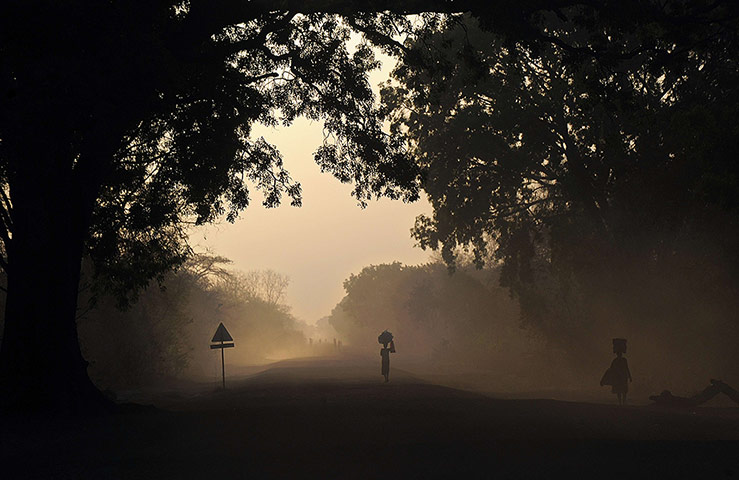 20 Photos: People are silhouetted at dawn in South Sudan