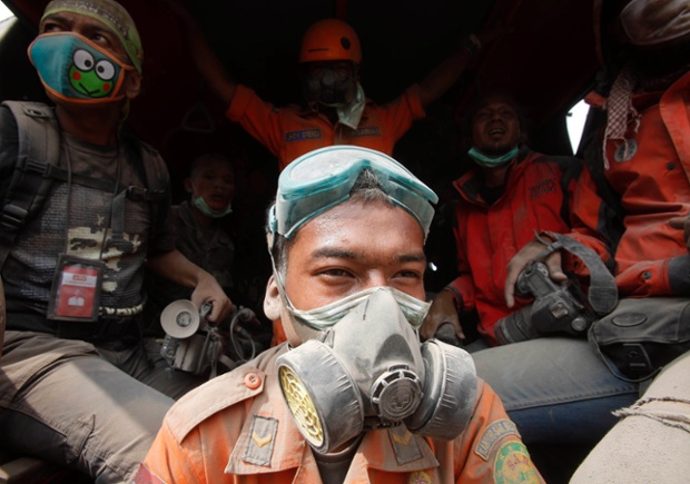 Rescue team members take a break during operations in Karo.