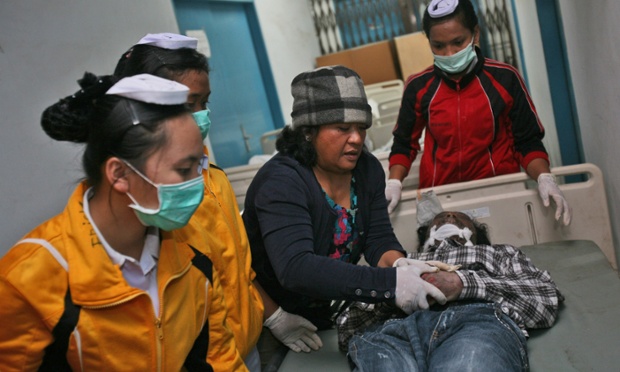Nurses tend a victim at a hospital in Kabanjahe