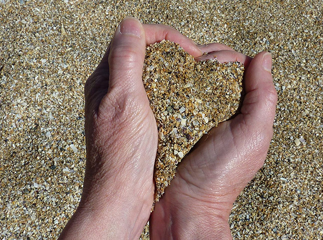 Your Pictures - Heart: hand holding sand in shape of a heart