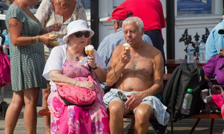 An elderly couple enjoy an ice cream on Brighton Pier in the summer heatwave of 2013. Heat-related deaths are expected to rise by 2050, as global warming causes temperatures to rise