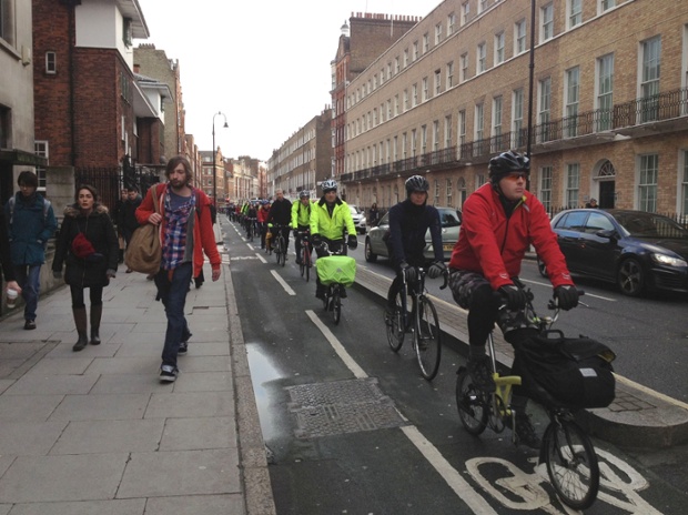 An unusally high amount of cyclists head to work along London's cycle paths at Tavistock Place.
