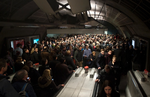 Commuters queue for access to the Jubilee line at Waterloo station.