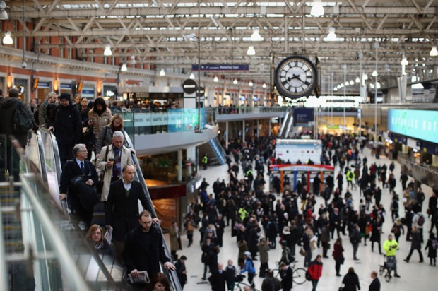 Commuters crowd Waterloo station.