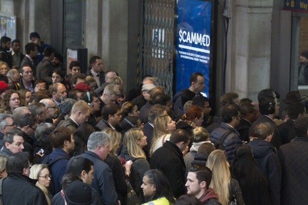 Crowds pour out of Waterloo station.