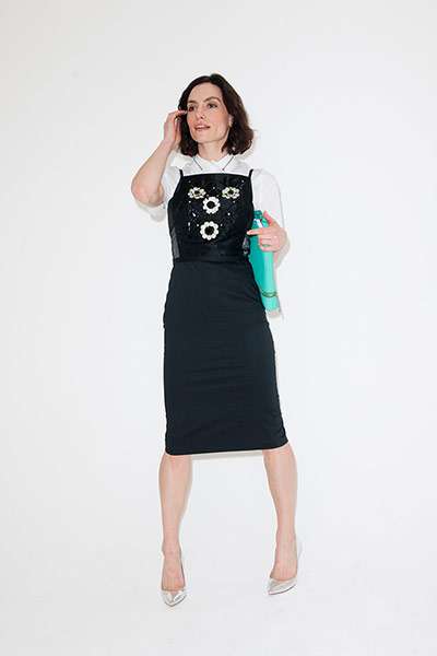 All Ages: white shirt black dress no sleeves silver high heels bag