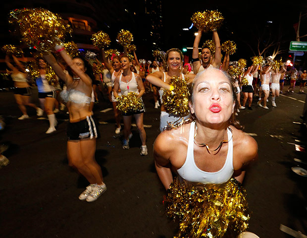 Mardi Gras: A participant at the 2014 Sydney Mardi Gras parade blows a kiss