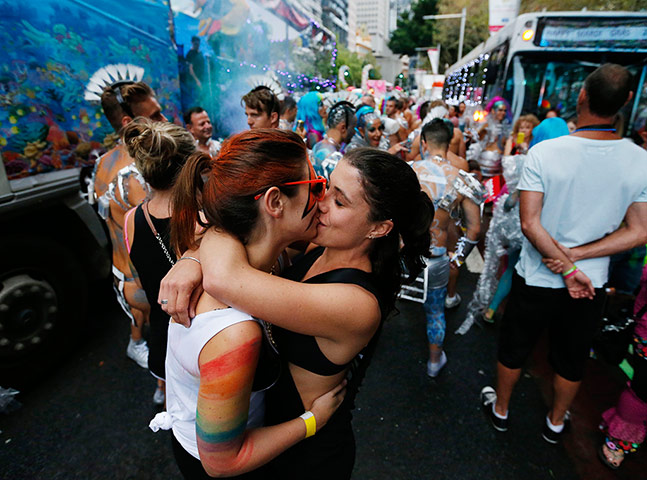 Mardi Gras: Women kiss during 2014 Sydney Gay and Lesbian Mardi Gras parade