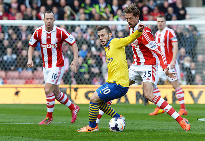 Roundup: Jack Wilshire shields the ball from Peter Crouch