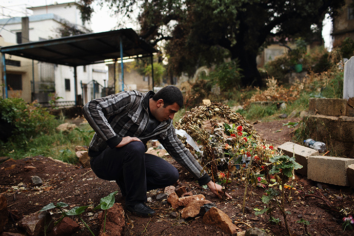 Qabaait, Northern Lebanon: A man visiting a grave