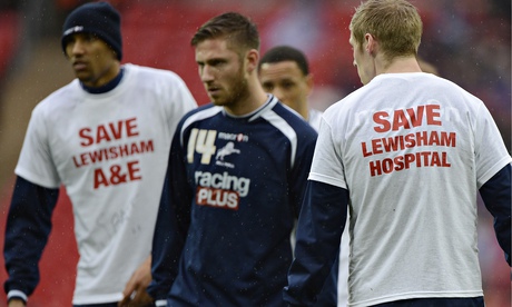 Millwall players in t-shirts supporting Lewisham hospital