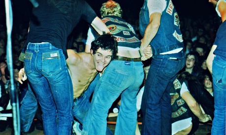 Burnel is dragged back on stage by Hells Angels during a 1977 concert in Bracknell. Photograph: Peter Still/Redferns