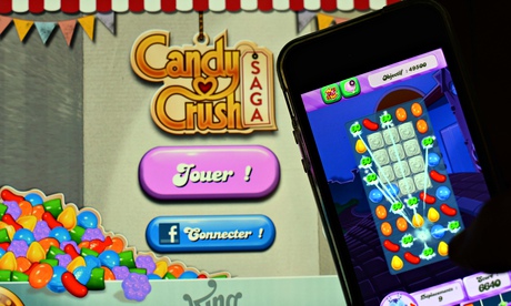 Candy Crush Saga being played on an iPhone